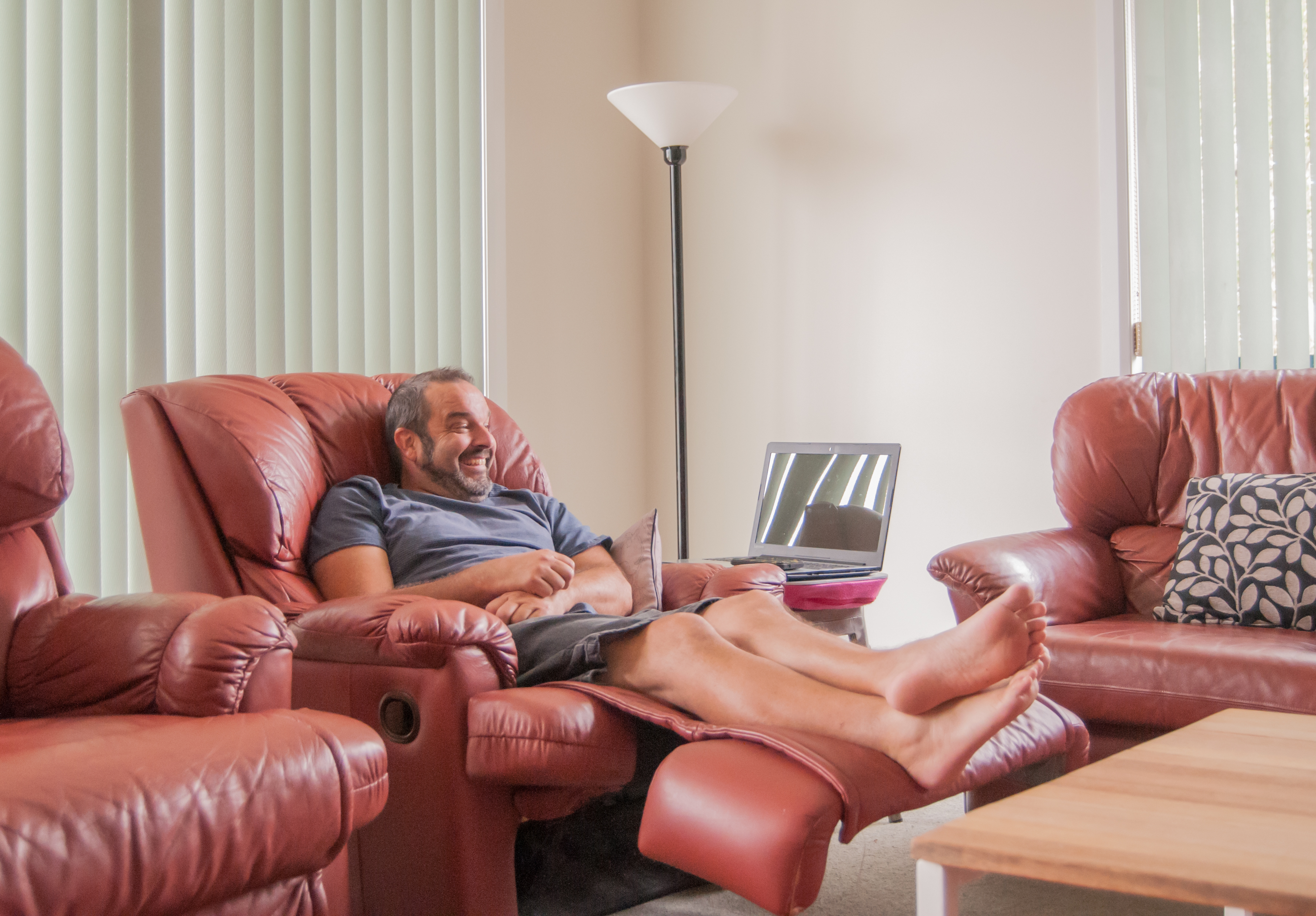 man sitting in a recliner in the living room