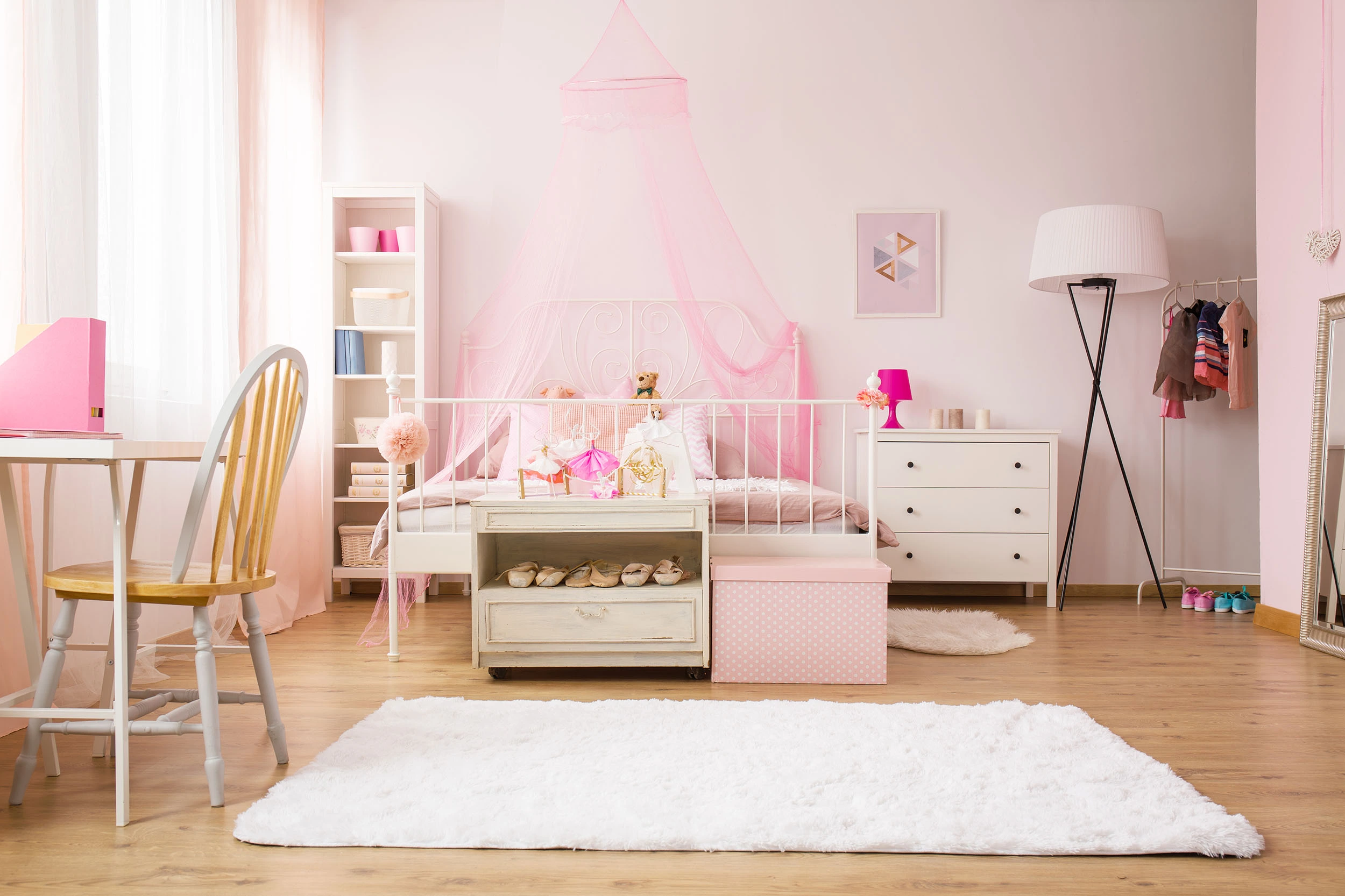 a pink child's bedroom