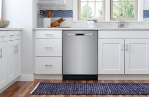 A Frigidaire top control stainless steel dishwasher displayed in a kitchen