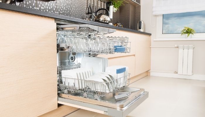 an open loaded dishwasher