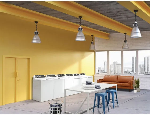 modern laundromat with yellow walls