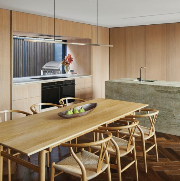 A paneled wood kitchen featuring luxury kitchen appliances