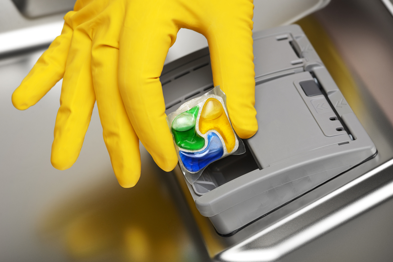 Placing detergent in dishwasher