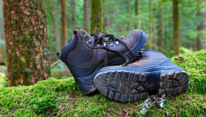 Dirty hiking boots in a forest