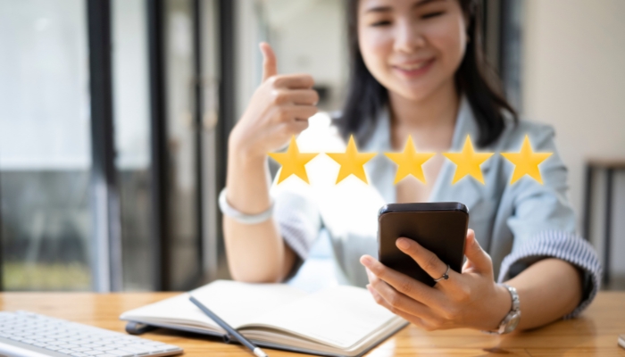 Woman checking out reviews on her phone