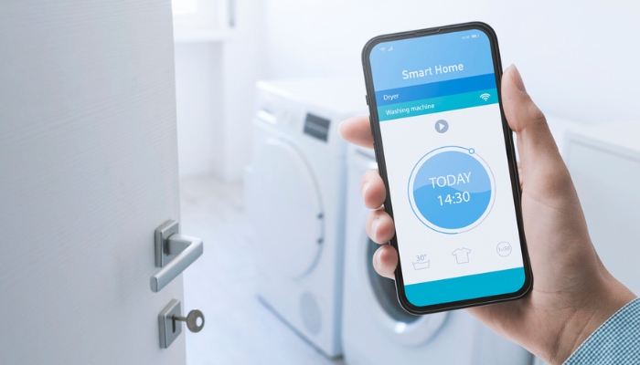 Closeup of smartphone monitoring washer time