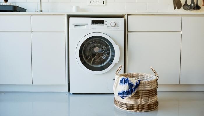 close up of a washer dryer combo unit in laundry room