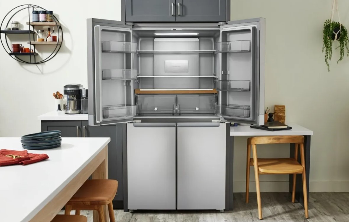Open doors of KitchenAid counter depth refrigerator in a kitchen