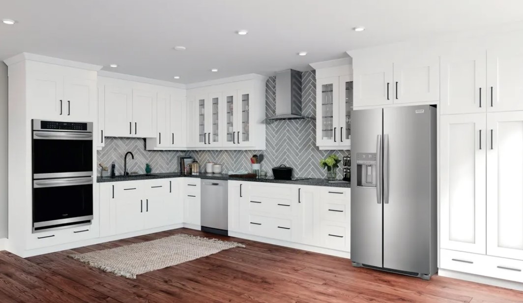 Stainless steel Frigidaire appliances are installed in a well lit kitchen