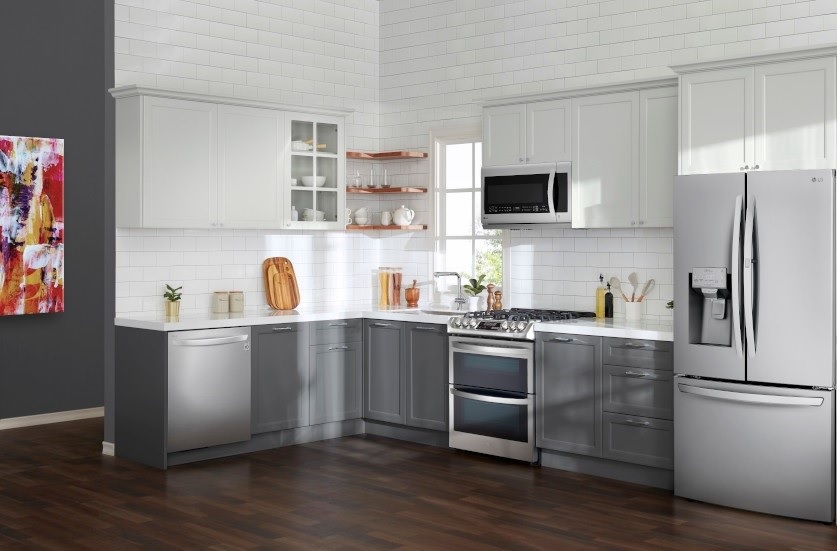 stainless steel LG dishwasher in white minimalist kitchen