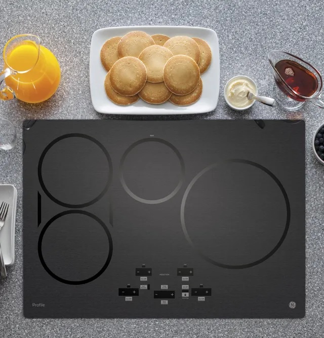 product image of GE Profile induction cooktop with breakfast ingredients
