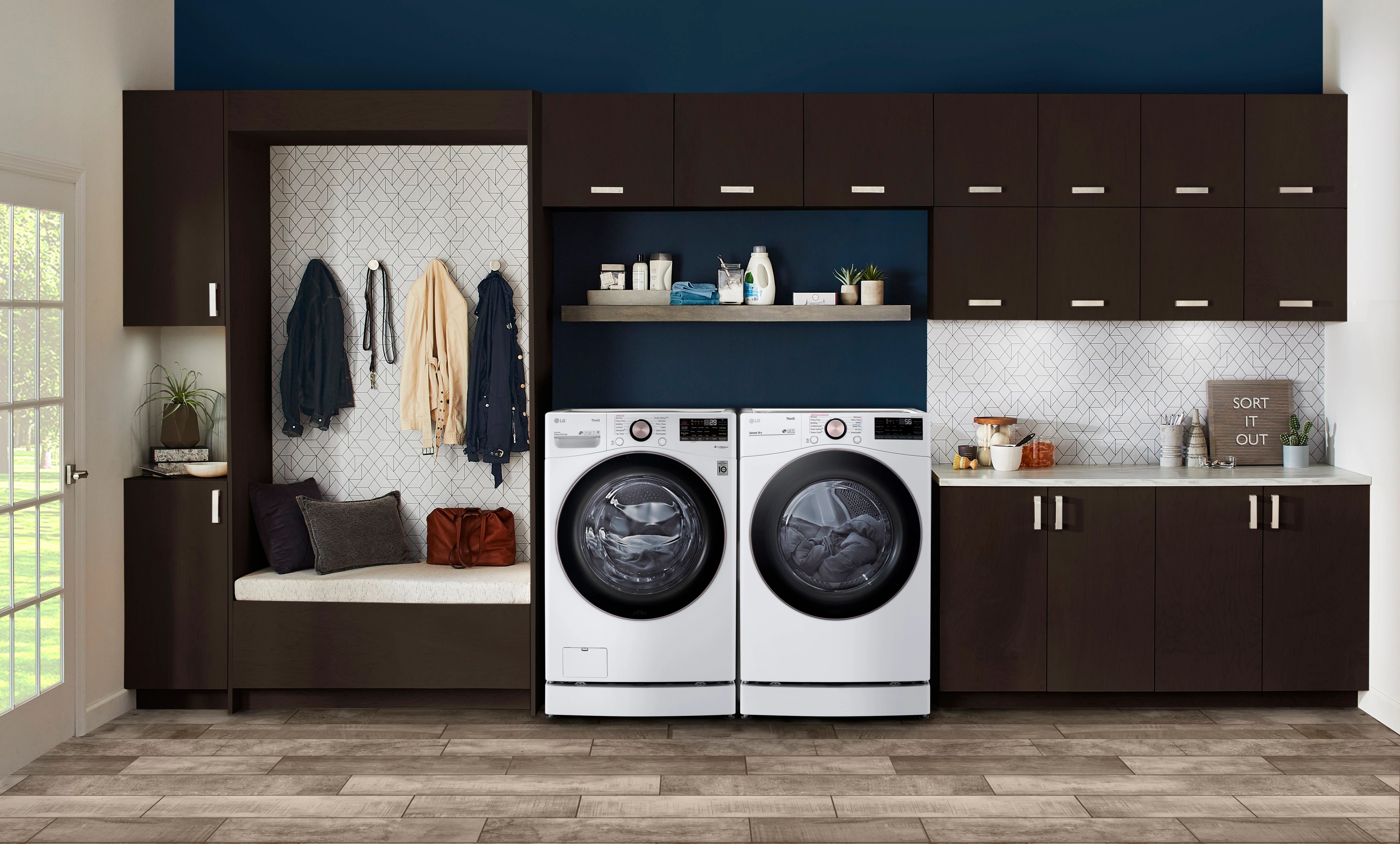 Wide shot of LG front load washer and dryer in a laundry room 