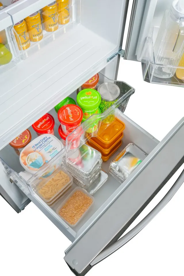 The Danby DBM187E1SSDB bottom freezer refrigerator with its freezer door open 