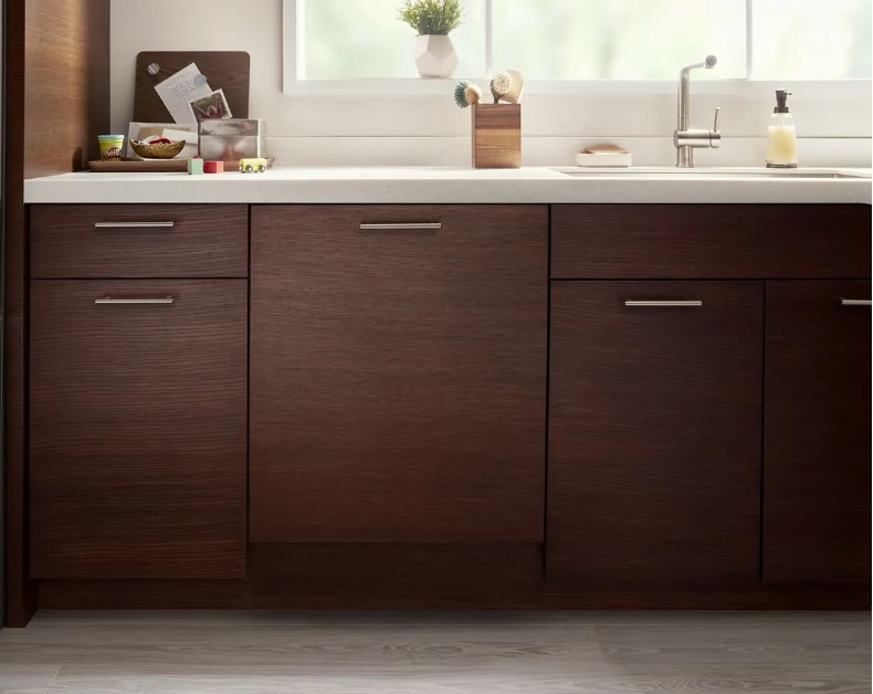 Wooden panel Whirlpool dishwasher in high-end kitchen