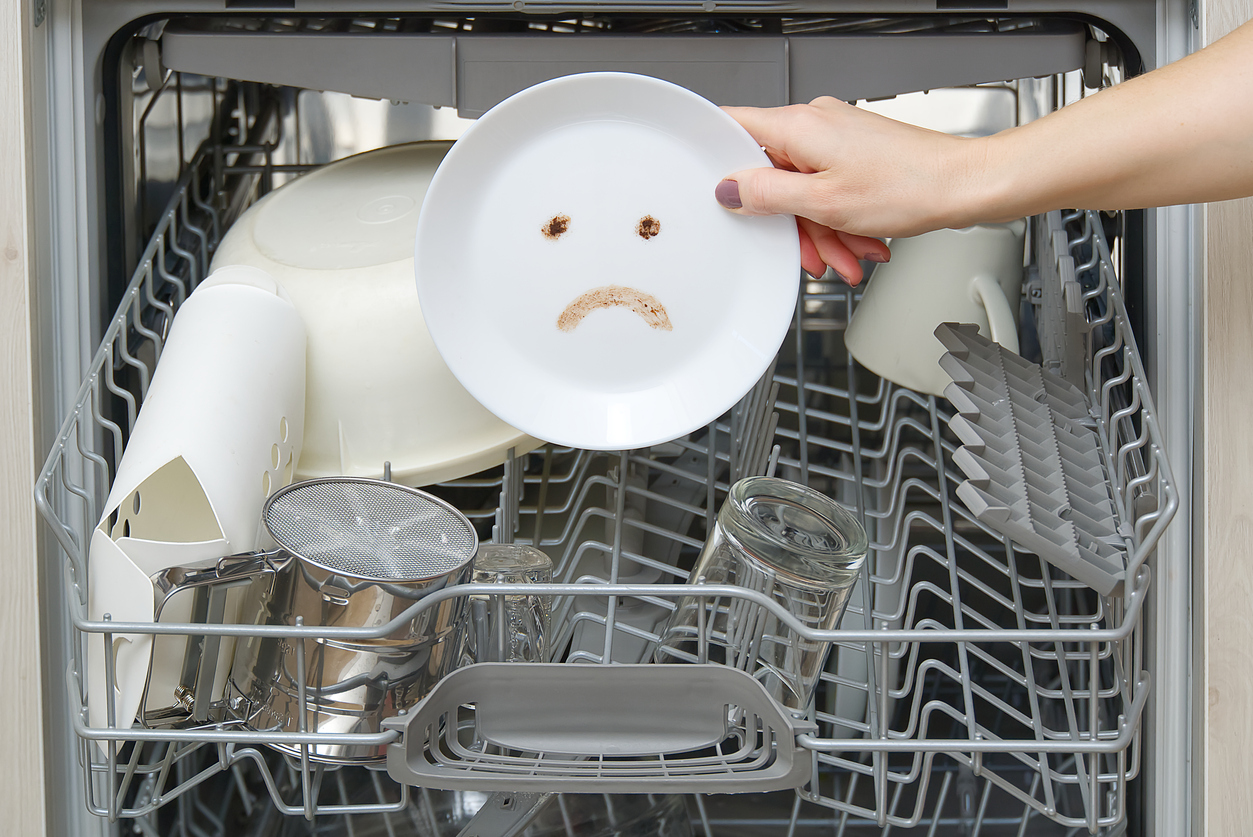 poorly washed dishes in the dishwasher