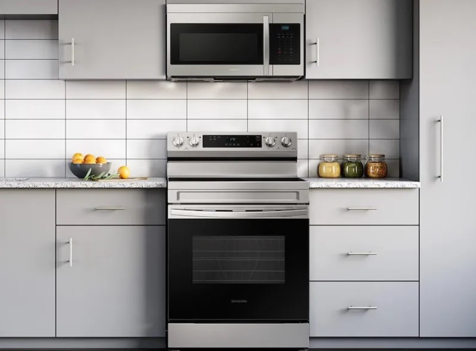 Samsung over the range microwave positioned above a stainless steel Samsung range