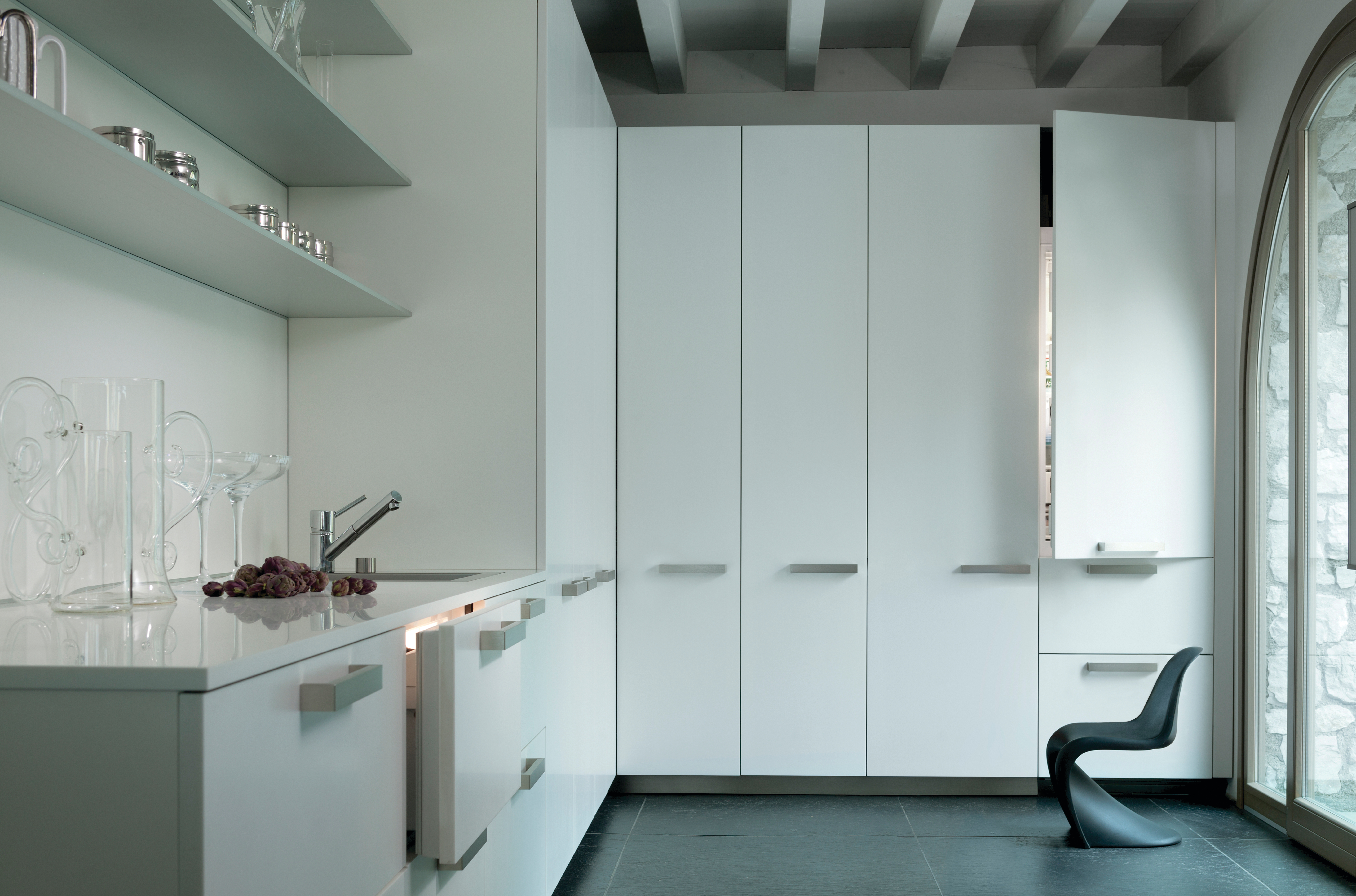 Sub-Zero column refrigerators and freezer with white panels in a modern kitchen 