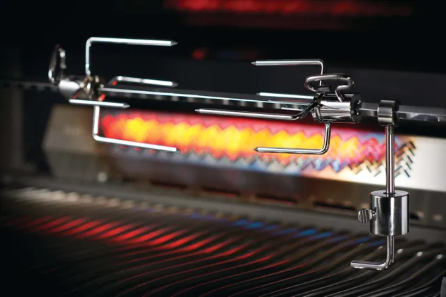 Up close view of the rotisserie attachment on the Napoleon Prestige Series P500RSIBPSS-3 grill 