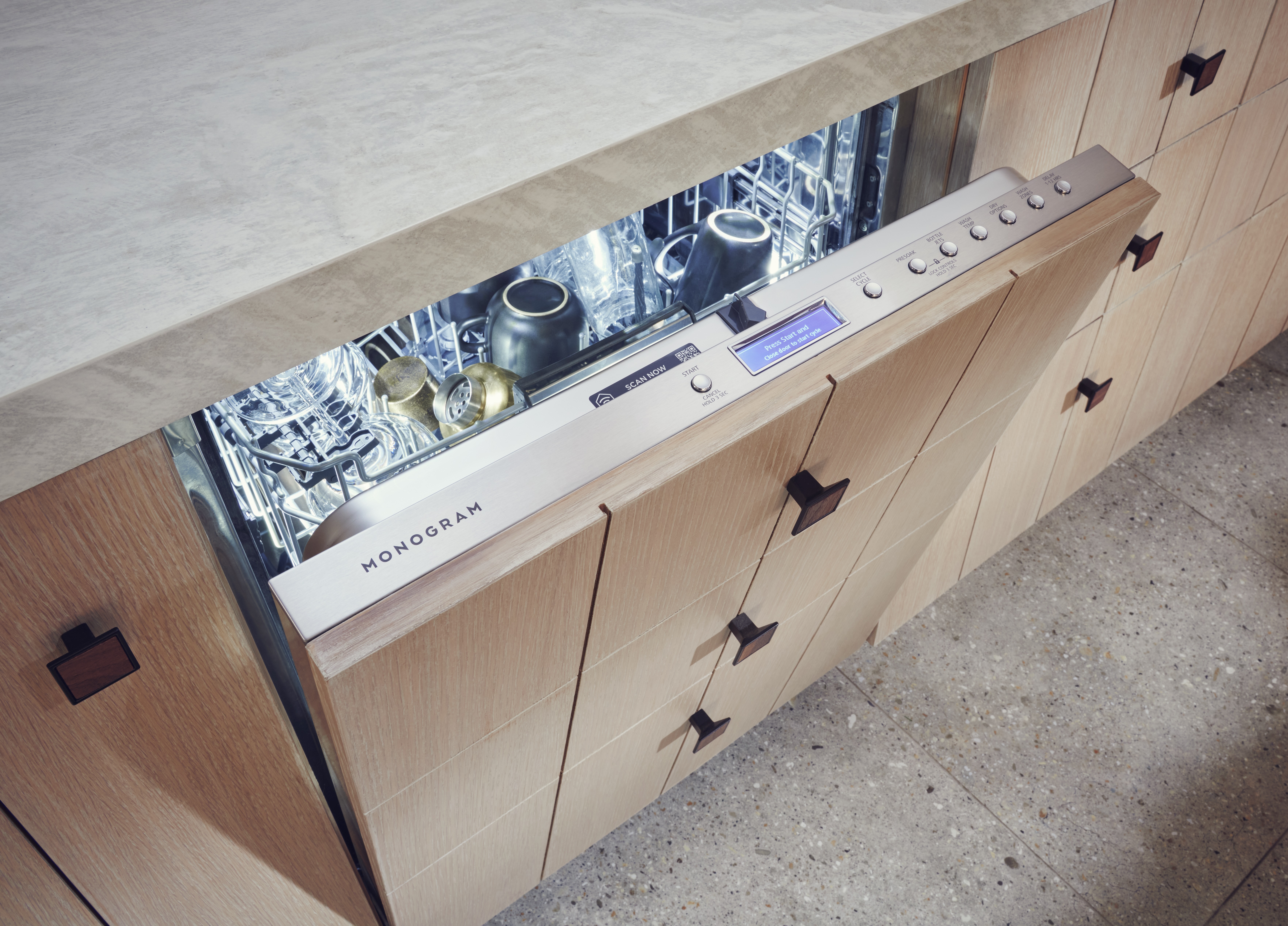 Monogram panel ready top control dishwasher with door ajar 
