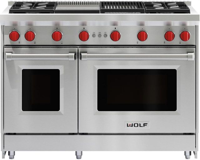 Stock photo of a stainless steel Wolf brand 48-inch range with two ovens and red knobs. 