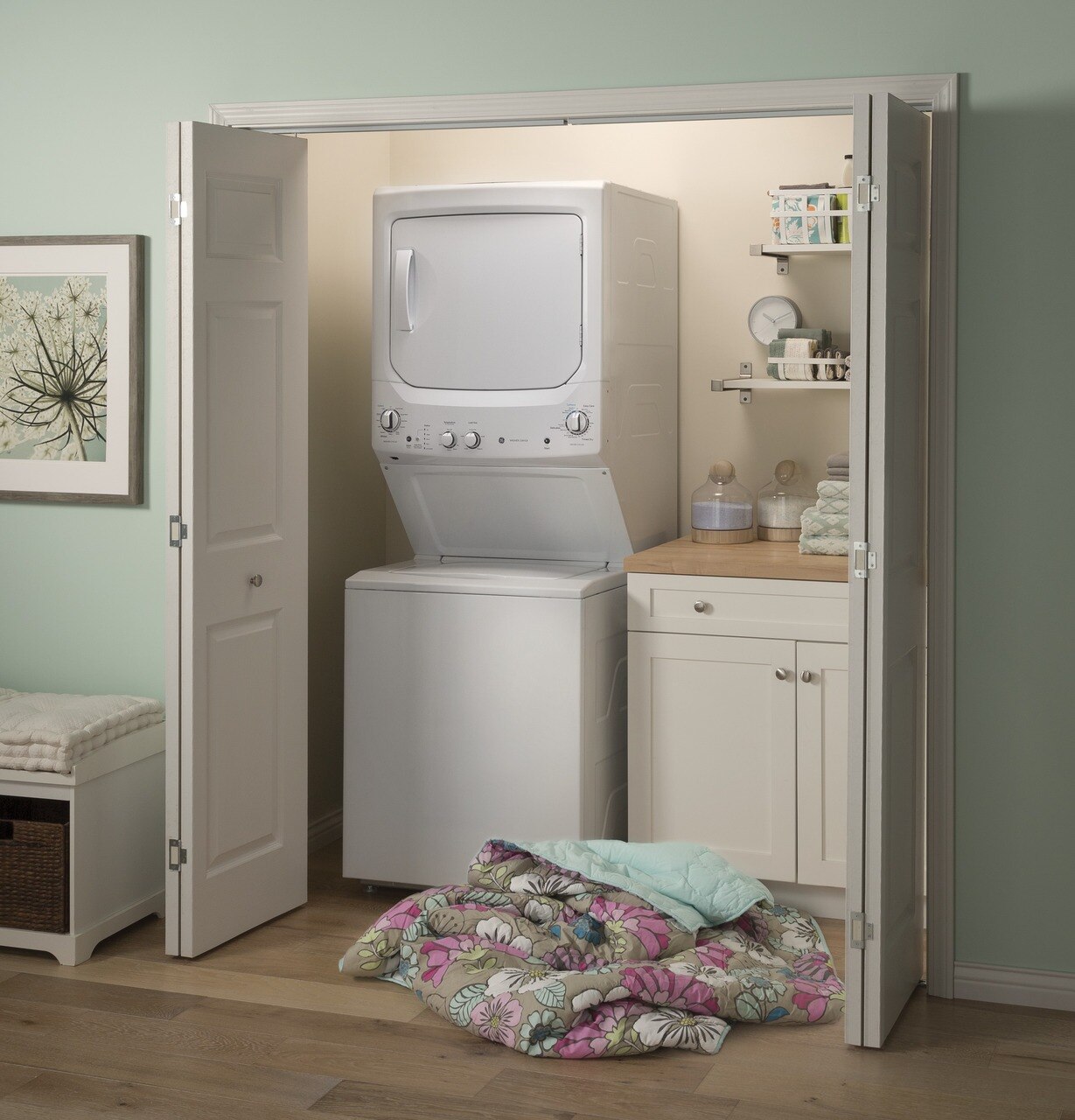 GE GUD27ESSMWW stacked washer dryer in a compact laundry closet 