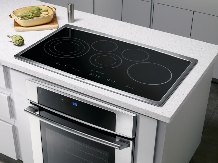 Electrolux Kitchen 36.75 inch Stainless Steel Electric Cooktop installed into countertop above an oven 