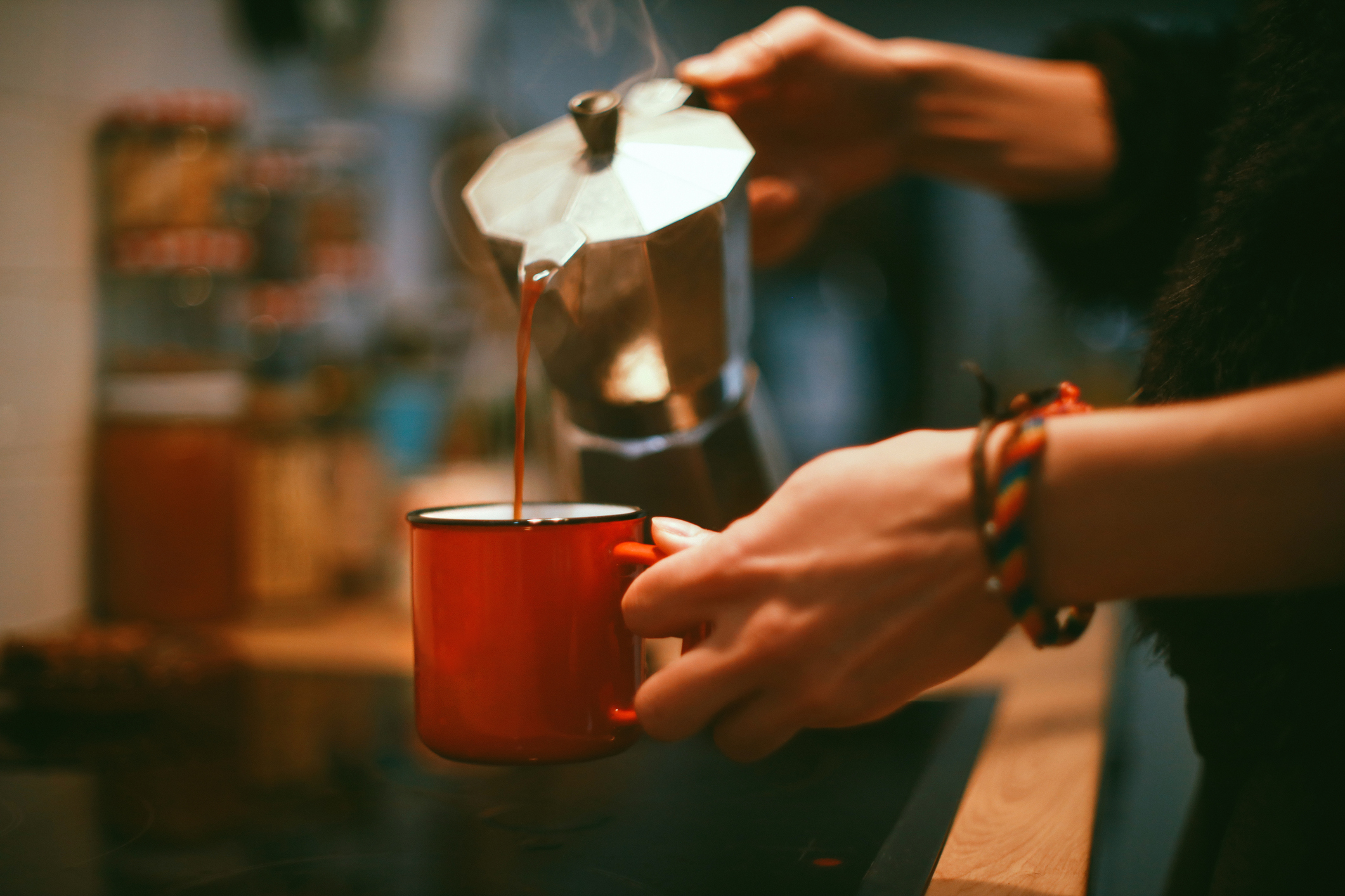 pouring fresh cup of coffee