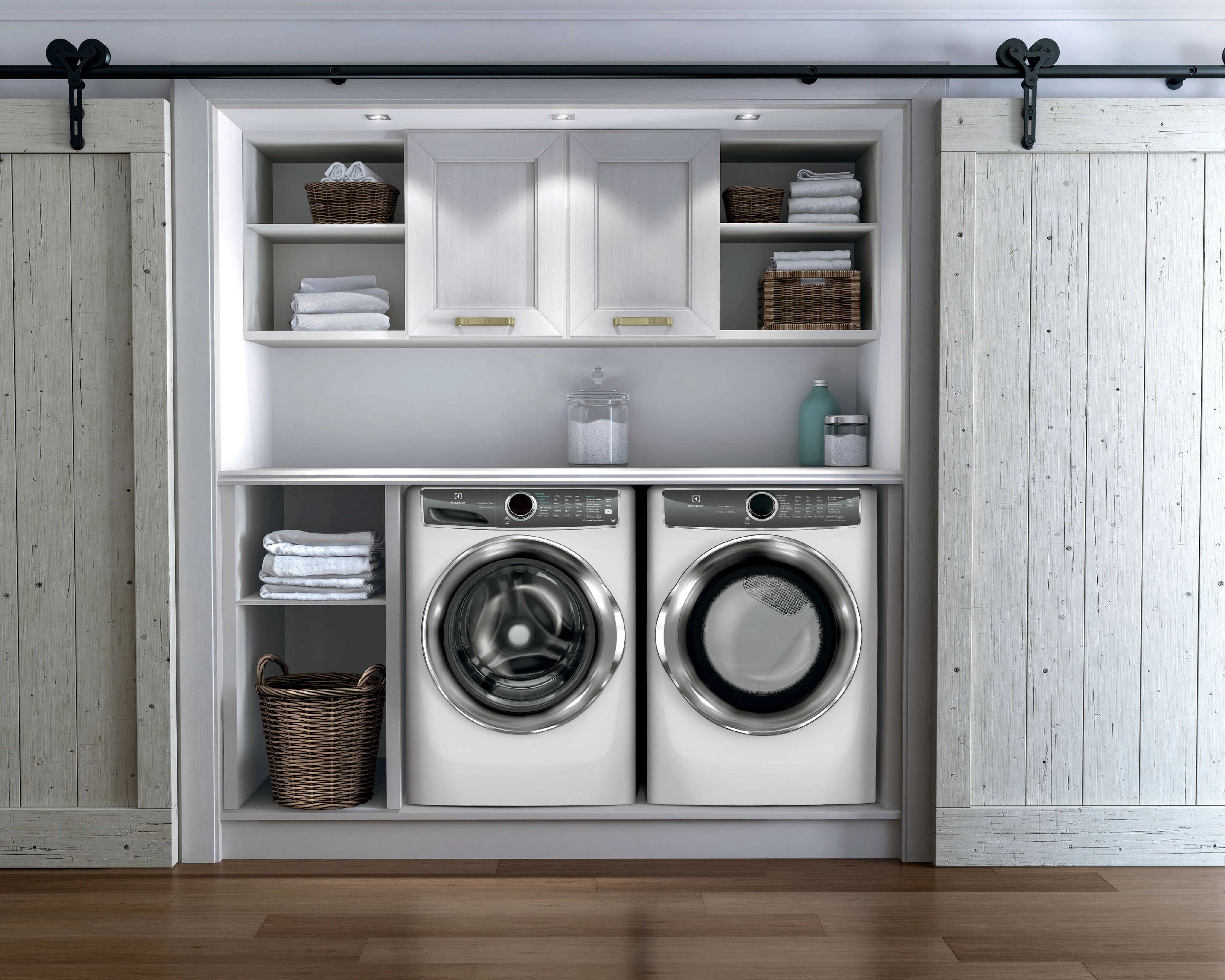 Electrolux white front load laundry pair in a well-organized laundry room