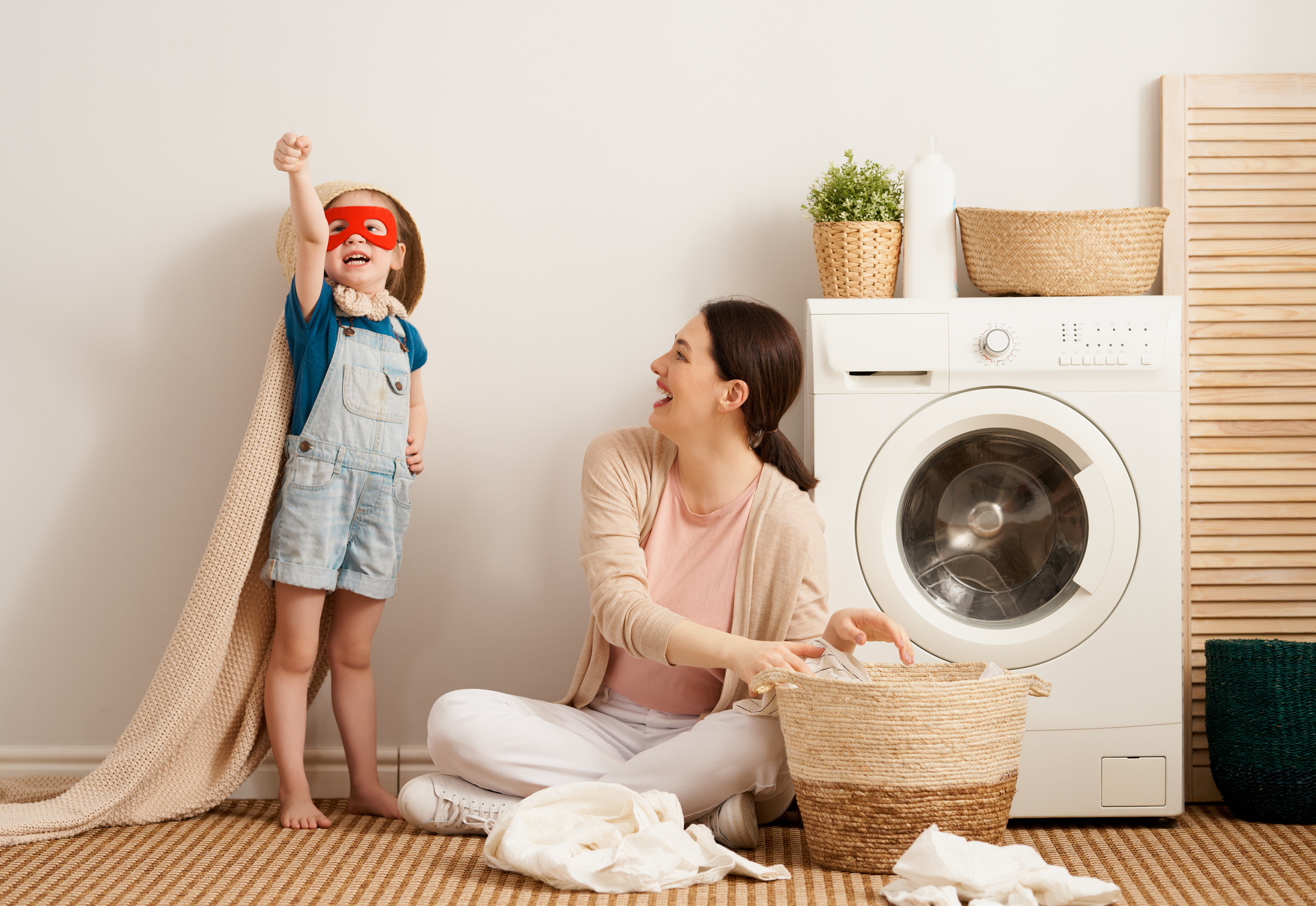 mother and daughter doing laundry together