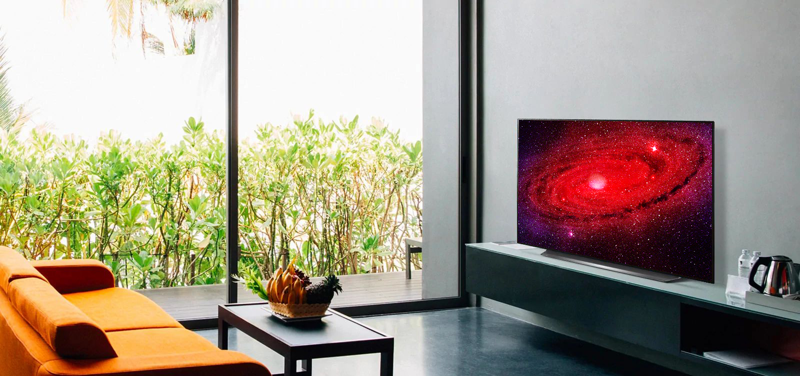 LG OLED TV sits on stand in stylish sunlit living room
