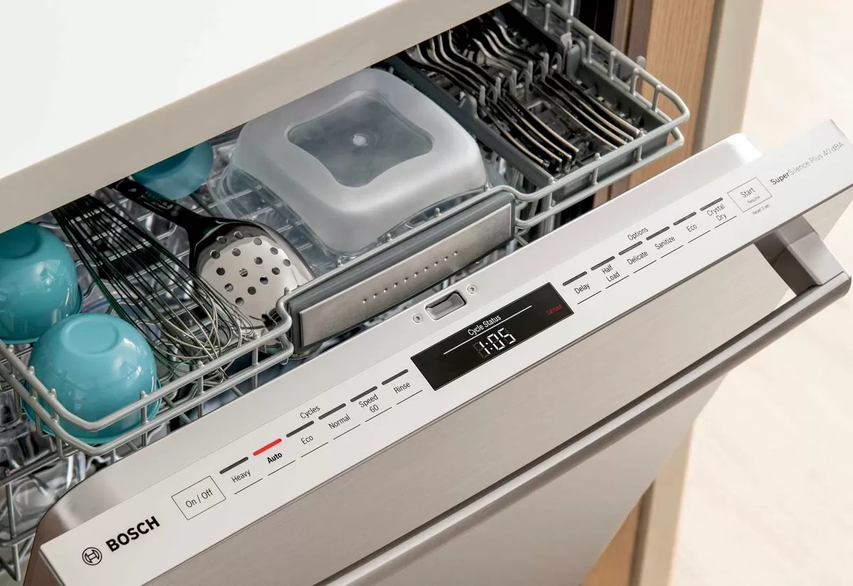 slighly ajar Bosch dishwasher reveals digital top control panel 