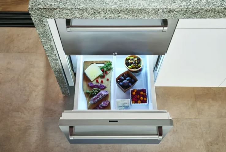 fridge drawers with cheese, olives, and figs