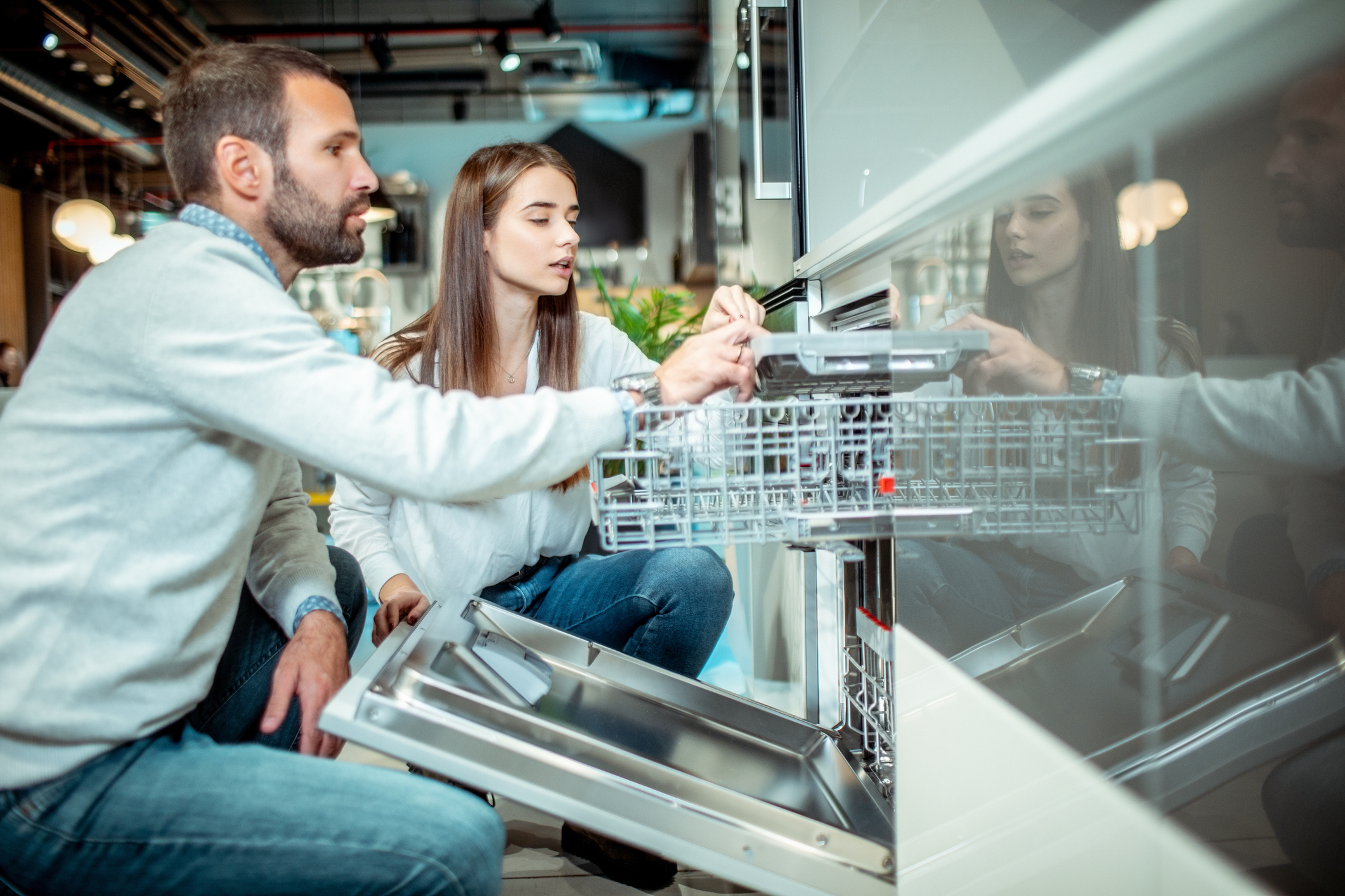 two people browsing scratch and dent appliances