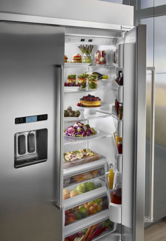 fully stocked KitchenAid side by side fridge