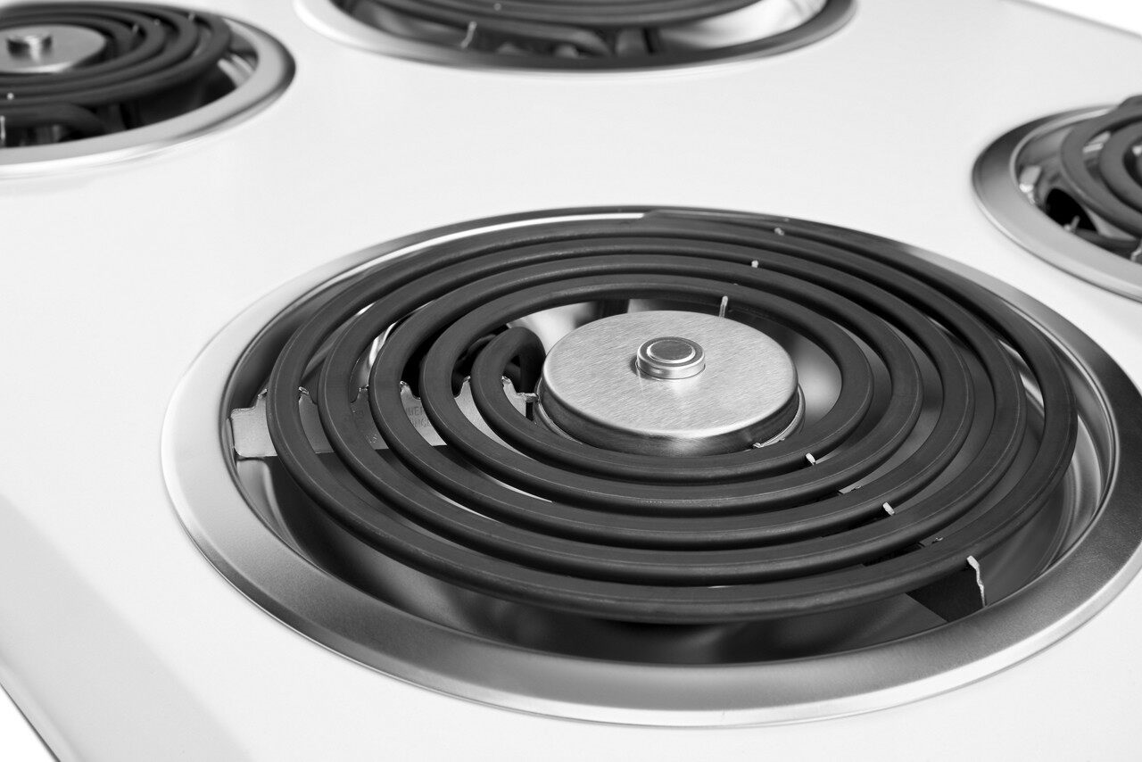 Closeup of Whirlpool 30 inch Electric Coil cooktop in a white finish