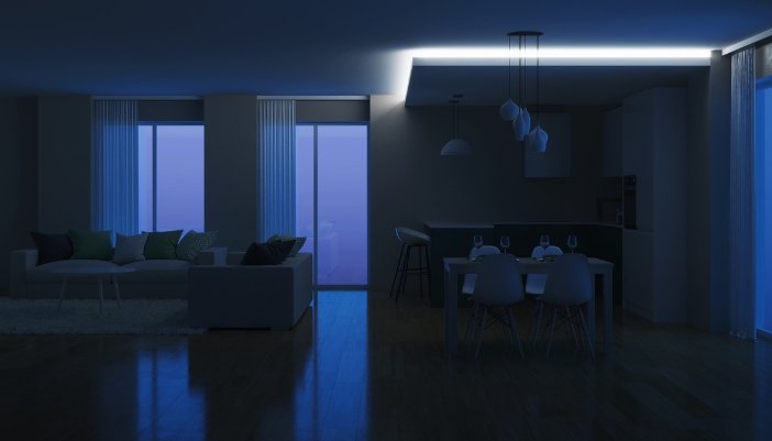 A smart home with automated darkened lights and open shades to get the last bit of warmth; only light on for movement