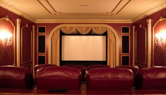 Elaborate home theater with unique crown molding & speaker trim