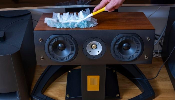 Hand dusting a speaker