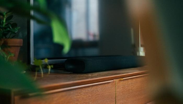 soundbar on tv stand in front of tv