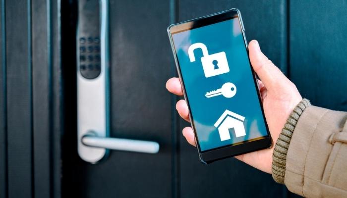 app on mobile phone unlocks electronic door lock in a smart home 