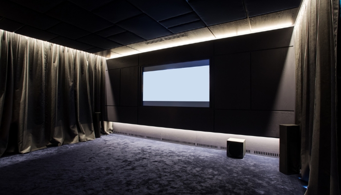 Home theater with blackout drapes