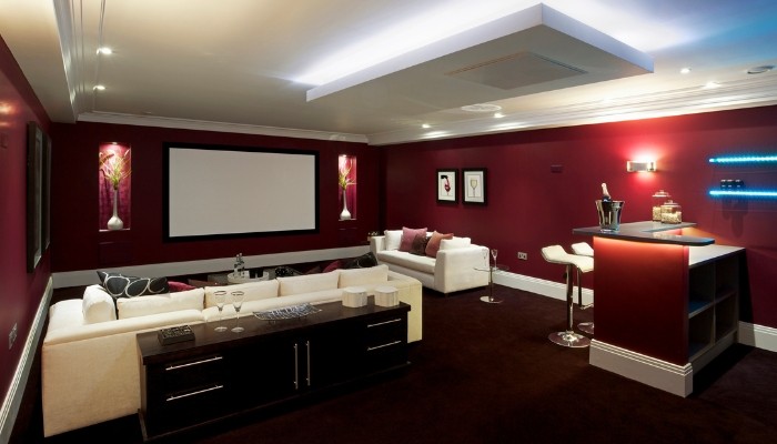 Luxury viewing room with home bar and recessed projector in the ceiling