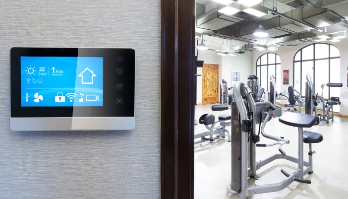 Smart home gym with a smart panel outside the door