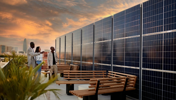 A commercial building with solar panels on the rooftop veranda