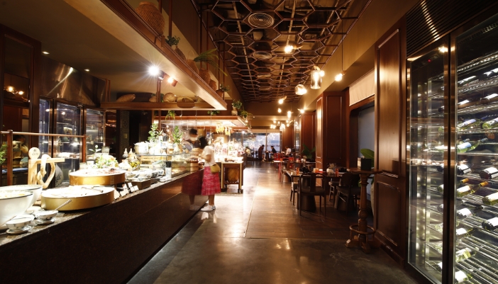 A busy restaurant with lighting and refrigeration