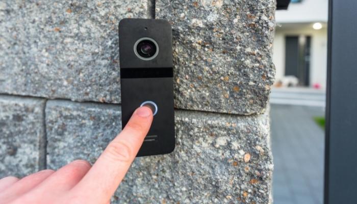 Finger pressing video doorbell