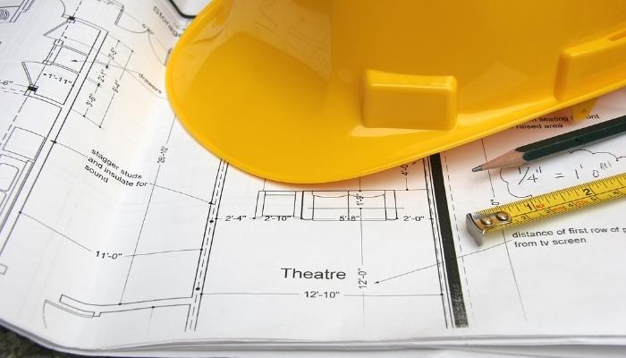 Hard hat place on top of home theater plans