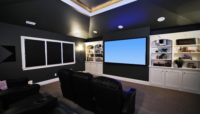 Big home theater with lots of furnishings