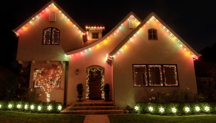 Home with Christmas lights on