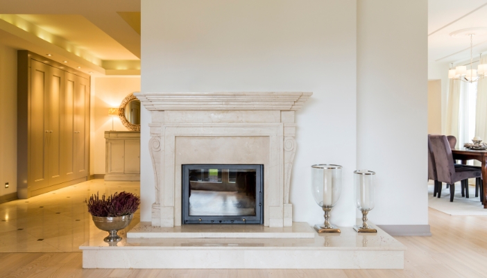 Fireplace mantle with empty space on top in an architectural beautiful home